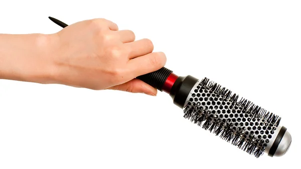 Mão com escova de cabelo — Fotografia de Stock