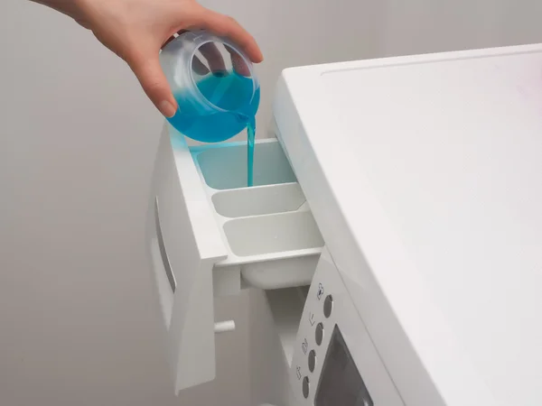 Adding detergent to dispenser — Stock Photo, Image