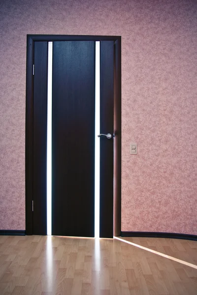 Ljus bakom dörren — Stockfoto