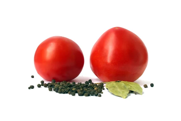 Two tomatoes and species — Stock Photo, Image
