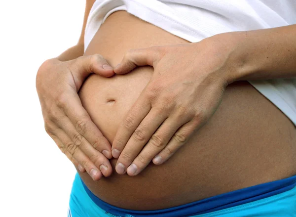 Pregnant woman with tan belly — Stock Photo, Image