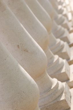 Small carved columns of beige color clipart