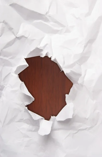 Hole in a crushed paper. — Stock Photo, Image