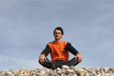 Young casual man at the beach