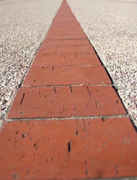 Детали некоторых красных кирпичей на тротуаре — стоковое фото