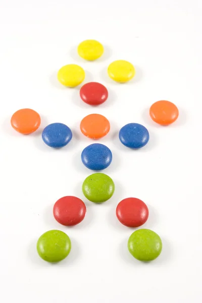 Panenky vyrobené z barevných lentilky — Stock fotografie