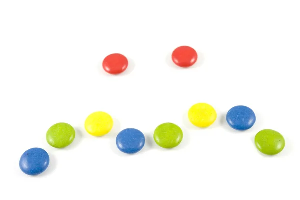 Face made of colored smarties — Stock Photo, Image