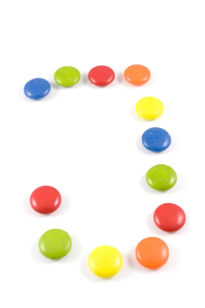 Letter J made of colored chocolates — Stock Photo, Image