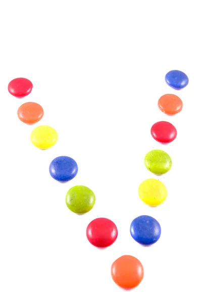 Letter V made of colored chocolates — Stock Photo, Image