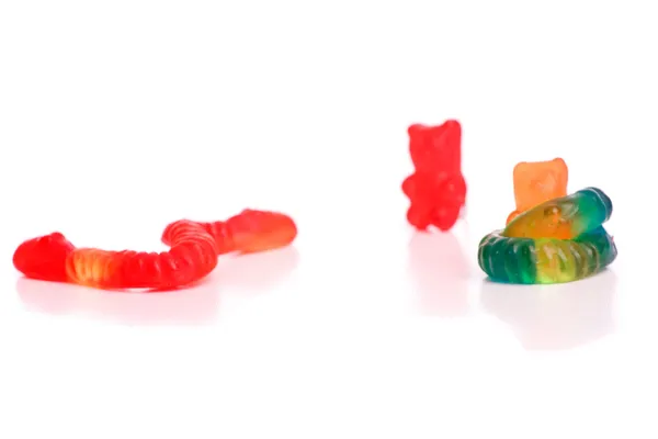 Snakes fighting with gummy bears — Stock Photo, Image