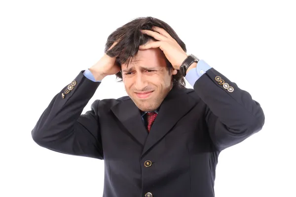 Беспокойный бизнесмен дергает за волосы — стоковое фото