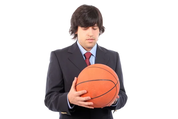 Homem de negócios segurando bola de basquete — Fotografia de Stock