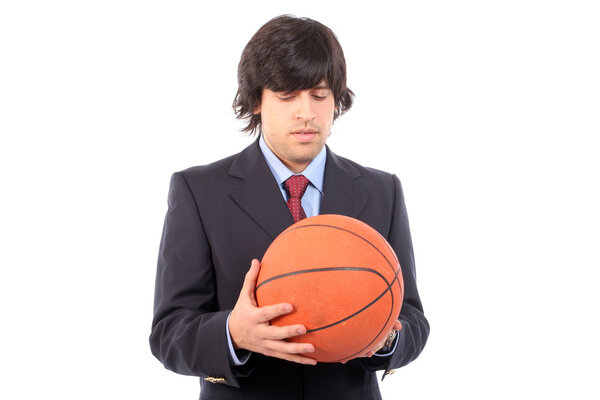 Business man holding basketball ball