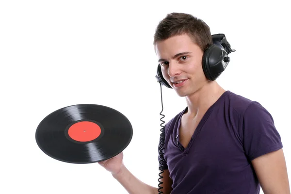 DJ im Kopfhörer dreht einen Teller um — Stockfoto
