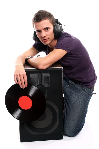 DJ sluchátka držící deskou — Stock fotografie