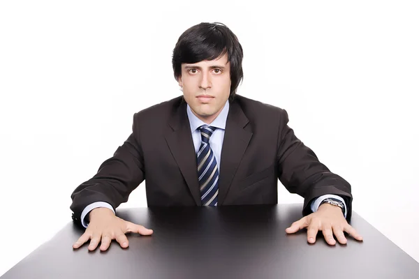 Jonge zakenman over een bureau — Stockfoto