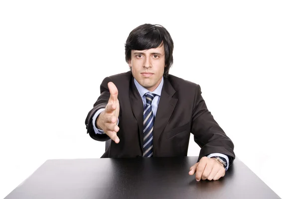 Young man in suit offering handshake — Stock Photo, Image