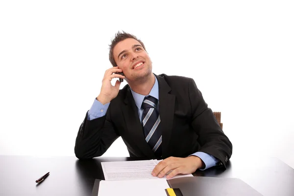 Молодой счастливый бизнесмен по телефону — стоковое фото