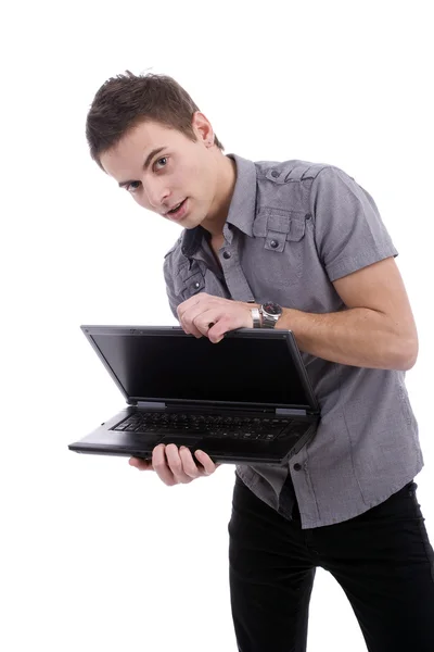Молодой человек, представляет ноутбук — стоковое фото