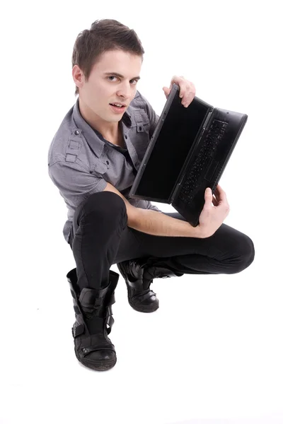 Giovane ragazzo che presenta nuovo computer portatile — Foto Stock
