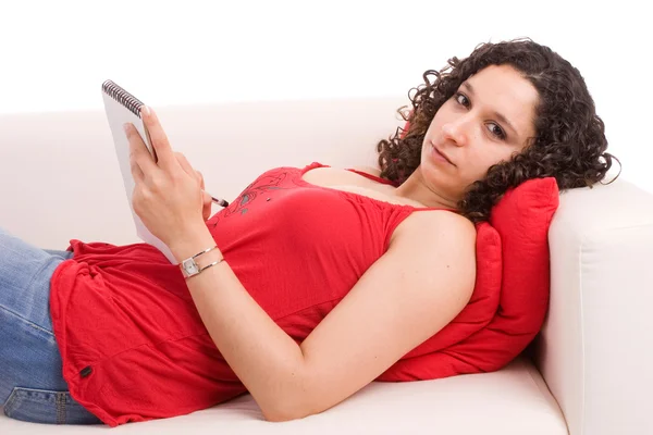 Young beautiful woman resting on couch — Stock Photo, Image