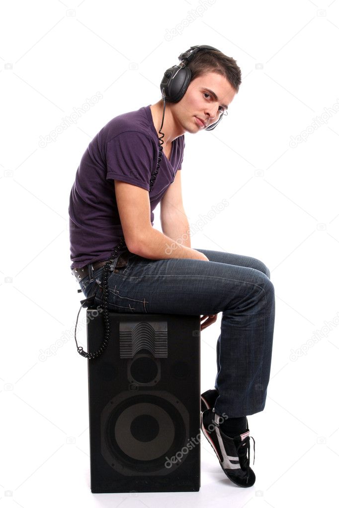 Young casual man listening to music