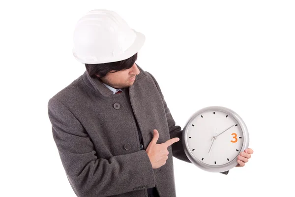 Ingeniero sosteniendo un reloj — Foto de Stock