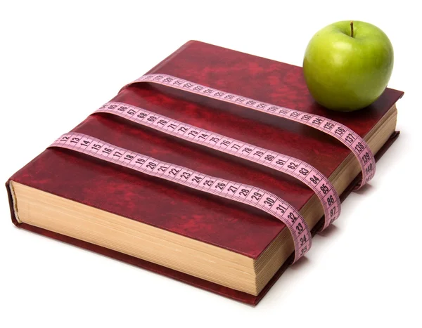 stock image Tape measure wrapped around book