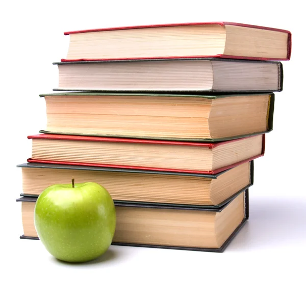 Apilado de libros con manzana —  Fotos de Stock