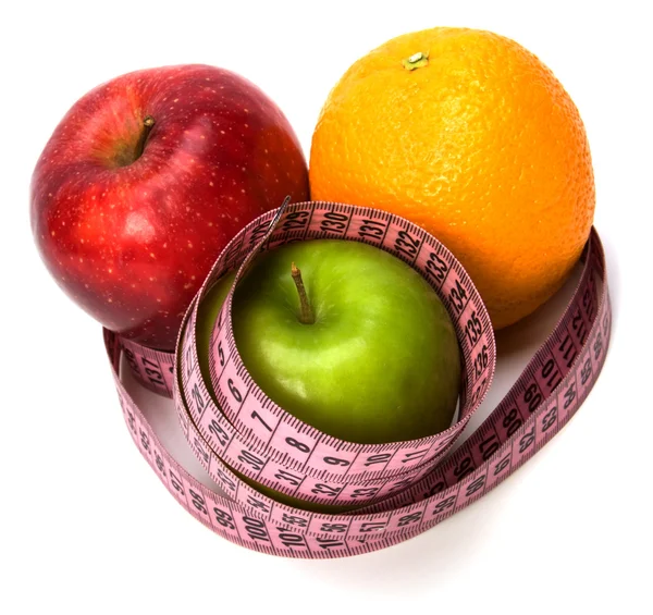 Tape measure wrapped around fruits — Stock Photo, Image