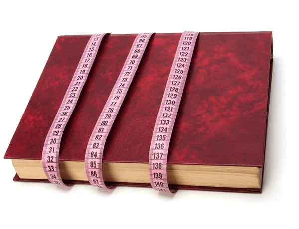 Tape measure wrapped around book — Stock Photo, Image