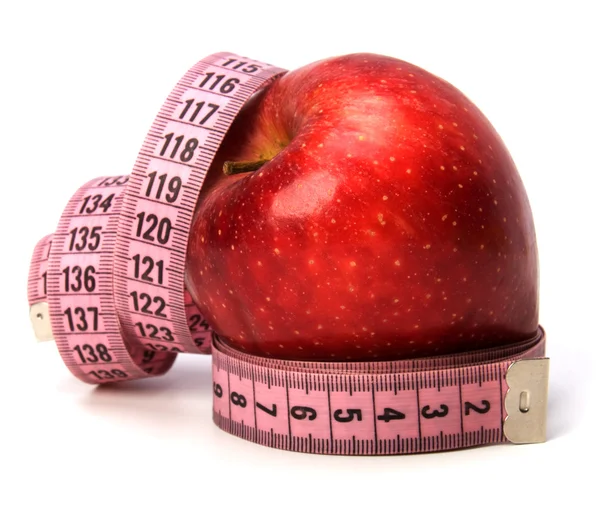 Fita métrica enrolada em torno da maçã — Fotografia de Stock