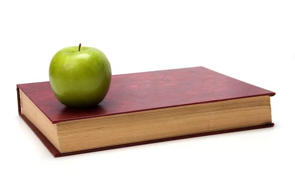Buch mit Apfel — Stockfoto