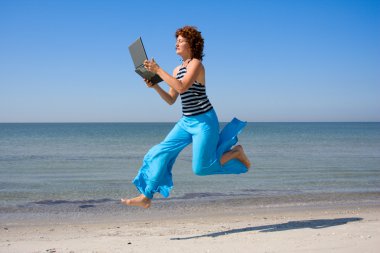 Woman running and lookinng to laptop clipart