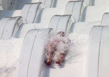 Child at a waterslide clipart