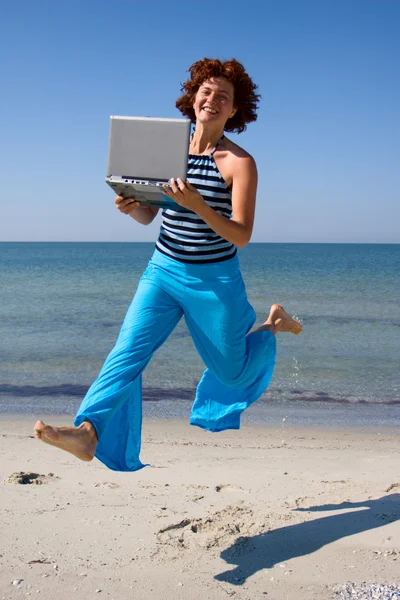 Running woman with laptop — Stock Photo, Image