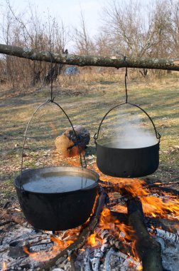 Pots above the fire clipart
