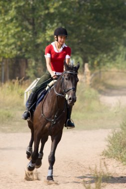 Woman riding horseback clipart