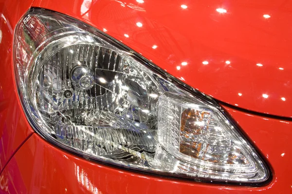 stock image Head lamp of red car