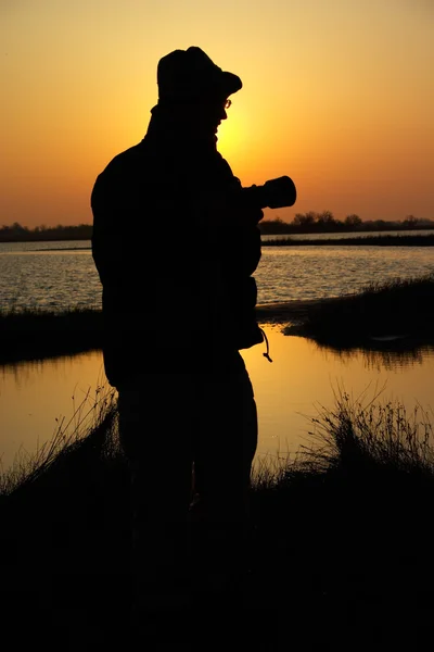 Silhouette of the photographer — Stock Photo, Image