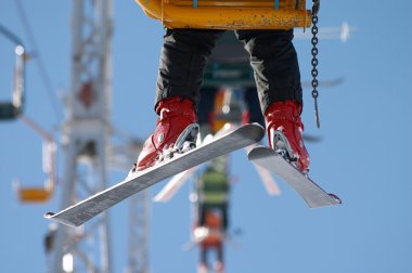 Skier on chair lift clipart