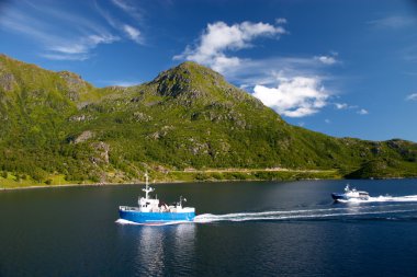 Ship on the sea near of lofoten island clipart