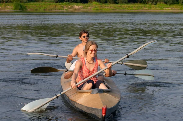 Tourists kayaking across the river — Stock Photo, Image