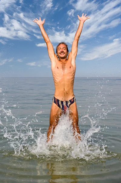 Man jumping in water — Stock Photo, Image