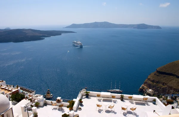 stock image Open air restaurant and liner in a sea