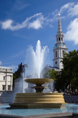 Fountain on Trafalgar Square in London clipart