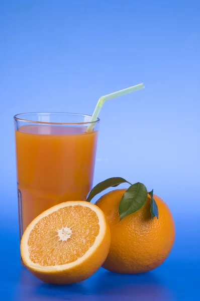 Orange food and drink over blue — Stock Photo, Image