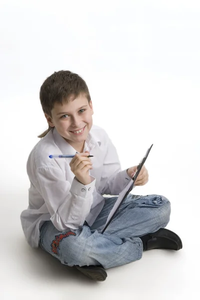 Stock image Boy in his teens with a clipboard.