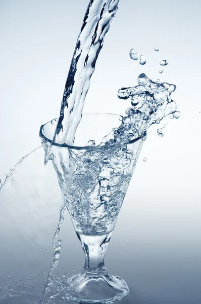 Pouring mineral water stream — Stock Photo, Image
