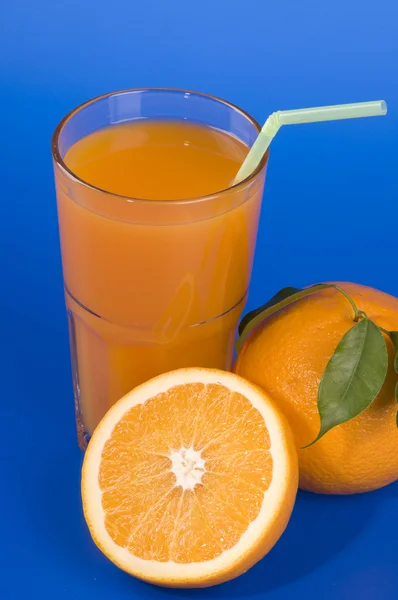 Orange food and drink over blue — Stock Photo, Image